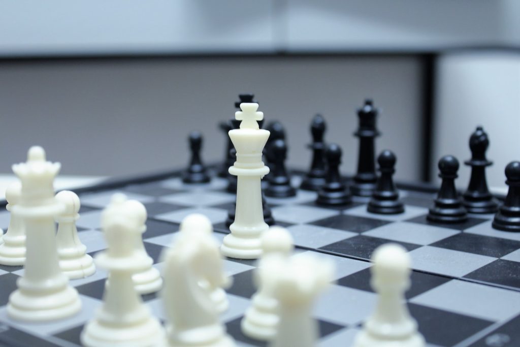 white chess pieces on chess board